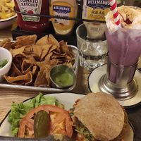 Mediterranean vegan burger + blueberry cake milkshake + nachos at Black Tap in Geneva