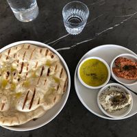 Bread and spread with babaganoush, muhammara, and double olive oil at Comune in Columbus