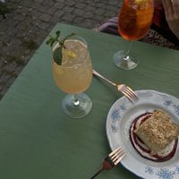wine spritzers and matcha cream cake  at Veganda in Warsaw