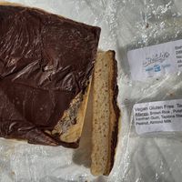 Tandy cake from stehly’s in the refrigerator. (The cake was spot on dense, but the almond butter was boring. The chocolate wasn’t tempered, so it got soft. Keep refrigerated.)  at VegOut in Bethlehem