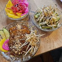 Tempeh glaze, Japanese pickles, and cucumber salad. at House of Seitan in Gdansk