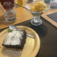 Chocolate brownie and mango ice cream 😋  at Govindas in Tenerife