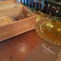 Freshly baked bread and olive oil plate at Peskesi in Crete