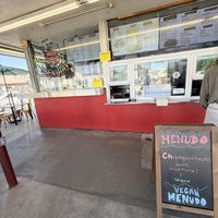 Sign in front advertising vegan menudo   at Garduno's Taco King in Baldwin Park
