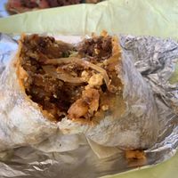 Soyrizo burrito cut open. I could only eat half because it’s so big. And I got nachos, but still.  at Garduno's Taco King in Baldwin Park