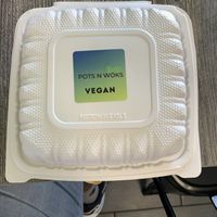 Clearly labeled vegan to go box  at Pots N Woks in Whittier