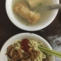 Dry noodles (topped with bean curd) that come with a bowl of soup (fried tofu and their signature stuffed bean curd roll are included)  at Lín MíngTáng SùShí Miàn 林明堂素食麵 in Lukang