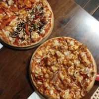 Half mushroom-half margarita pizza, Pineapple pizza at Caldo Gourmet Pizza Bar in Beer Sheva