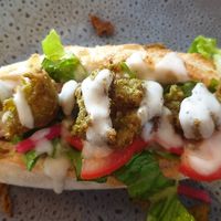 Pea falafel with pickle turnips, vegan mayo and salad at Feedback Cafe in Yarraville