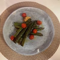 Grilled asparagus, cherry tomatoes and crushed peanuts,   at Restaurante Amaltea in Cordoba