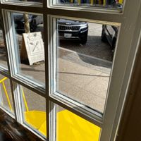 A frame sign out front with outdoor seating  at Root in Newport