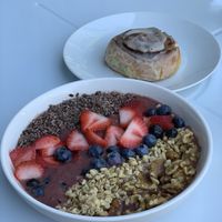 Cinnamon bun and açaí bowl  at Root in Newport