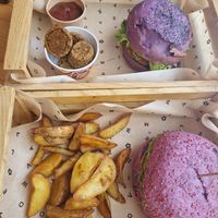 Delicious 2 different burgers and fries and spicy sauce and Flower Bombs 🥰 at Flower Burger in Bari