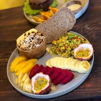 Combo: Scrambled tofu, toast, fruits, Nutty Overnight Oats + a coffee! at Nourish in Hoi An