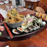 Vegan taster menu mains + a “mix 12 pieces” (placed together on a boat, because we were sharing anyway :))  at Legumi Sushi Vegan in Lisbon