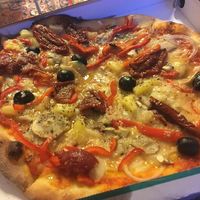 Azzuras no. 4 vegetarian pizza made vegan by switching the cheese to vegan cheese - and with sundried tomatoes and olives instead of asparagus.
 at Azzurra Nordkraft in Aalborg