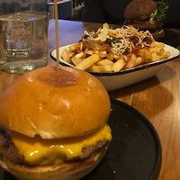 Beef cheese burger, loaded fries (vegan option) and in the background is the spicy lentil burger at Burger Baby in Margaret River