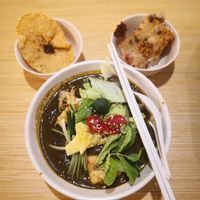 Assam laksa with slurpilicious thick gravy. Top left is crispy wonton and top right is their special carrot cake. at Thunder Tree 擂茶树 - VivoCity in Central Singapore