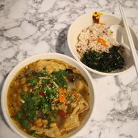 Vegan miso and homegrown sauerkraut in spicy soup with brown rice and greens from their own farm. at Thunder Tree 擂茶树 - VivoCity in Central Singapore