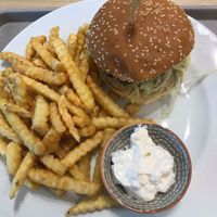 Burger with fries and vegan mayo. A big portion of fries that were pretty good and the burger itself was satisfying.  at Loving Hut - Zlicin in Prague