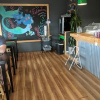 Sitting area with bar to right at The Spot in Kapaa