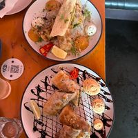 Smoked butter chicken roti rolls (Top) and duck roti rolls (bottom) at Tyranny of Distance in Windsor