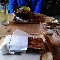 From top left clockwise: ginger tea, tomato soup, carrot cake, purple rain, fake chicken sandwich at Mr. Morris in Tilburg