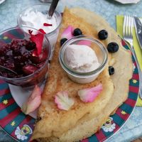 Vegan pancake with warm cherries, blueberries, icecream & whipped cream at Toet in Groningen