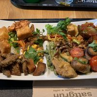 Protein dense plate full of different kinds of tofu, vegetables and flavors. at Sattgrün Kolumba Viertel - Mitte in Cologne