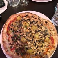 Excellent vegan truffle Pizza with truffle Creme, champignons, potatoes and fresh herbs😍  at MammaMia in The Hague