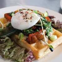 Brunch waffle with roasted pumpkin, kale pesto & poached egg at Jord & Bord Örnahusen in Borrby