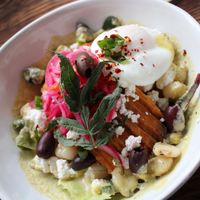 Homemade tamale with giant corn, salsa criolla, chilicream & poached egg. at Jord & Bord Örnahusen in Borrby