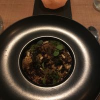 Black truffle foam covering a mushroom cream at Seiperdue in Rome