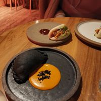 Bao bun. Black empanada. at SACRO in Buenos Aires