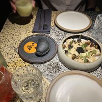 Empanada, raviolis, vegetable cobbler mocktail, hibiscus kombucha cocktail  at SACRO in Buenos Aires