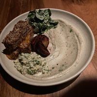 Quinoa tempeh, roasted plum, hummus, risotto, salad at SACRO in Buenos Aires