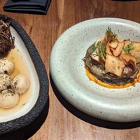 esquerda: ricota de castanha de caju com cogumelos e caldo de algas, direita: folhado com cheddar de abóbora at SACRO in Buenos Aires