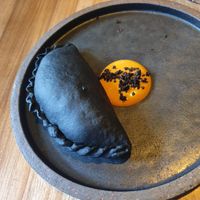 Black empanada at SACRO in Buenos Aires