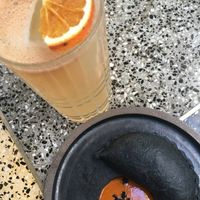 Black empanada and citric kombucha in Sacro. at SACRO in Buenos Aires