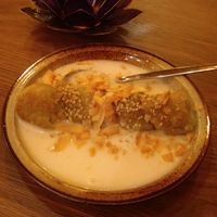 Deep fried banana dessert with almonds and sesame, in a coconut sauce at Quan Xanh in Leipzig