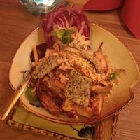 Papaya salad with Seitan and black sesame crackers at Quan Xanh in Leipzig