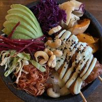 Yummy vegan bowl with Tempeh, pumpkin and kimchii  at Secret Garden in Berlin