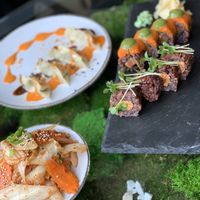 Kimchi, dumplings and sushi. Note the v salmon at Secret Garden in Berlin