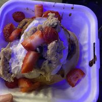 roll with cream cheese frosting, cookie dough, and strawberries  at Cinnaholic in Seattle