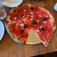 Rosso pizza with olives  at Kokeshi in Salem