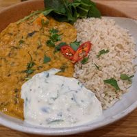 Peanut butter and sweet potato dhaal with spinach and raita at Vertigo - Cross St in Manchester