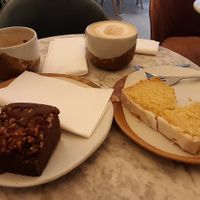 Latte coconut milk, cake with lemon glaze and pecan brownie at Vertigo - Cross St in Manchester
