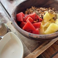 Fruit with granola  at Benny's On The Beach in Koh Lipe