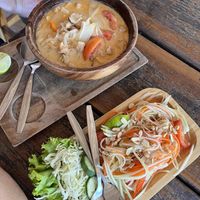 Tom yum noodle soup and som tam papaya salad  at Benny's On The Beach in Koh Lipe
