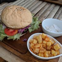Burger with a side of potatoes, and aioli - all vegan :) at Benny's On The Beach in Koh Lipe